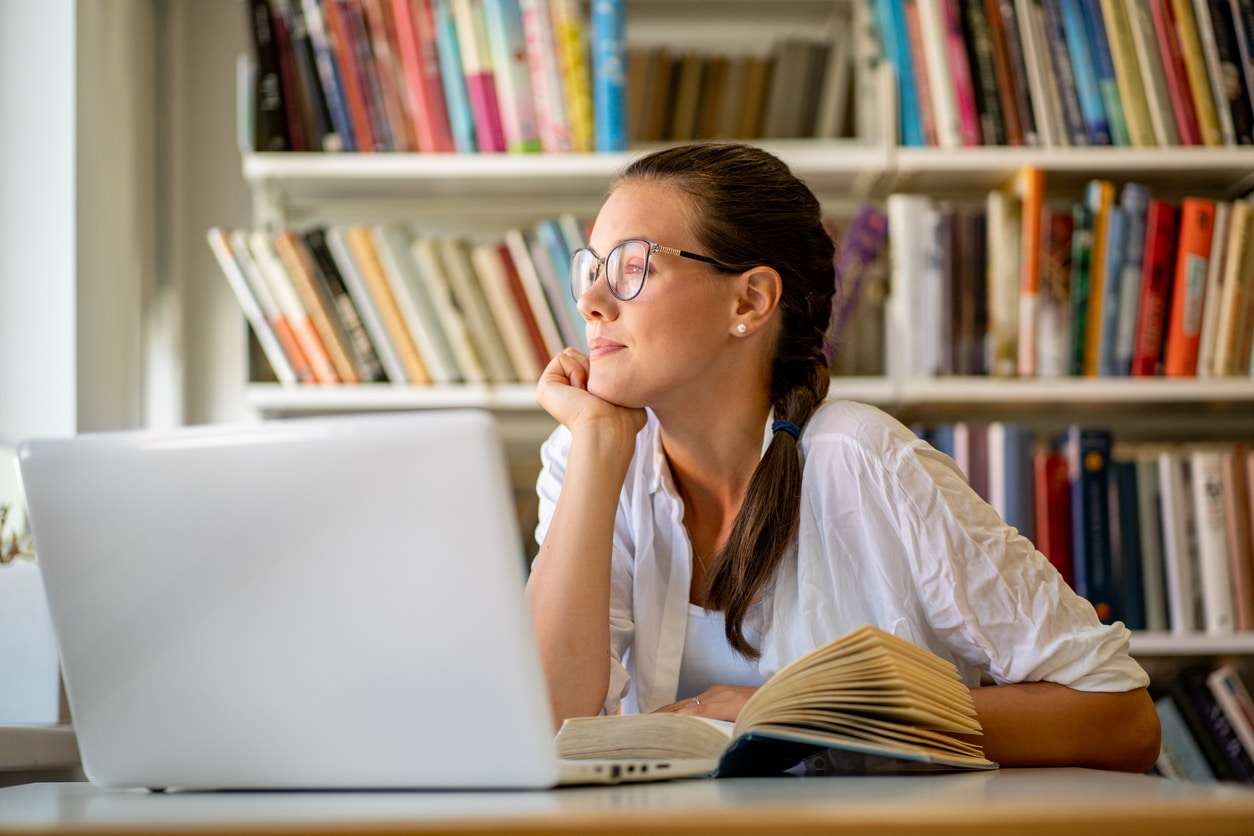 Adult woman with ADHD struggling to concentrate on her work.